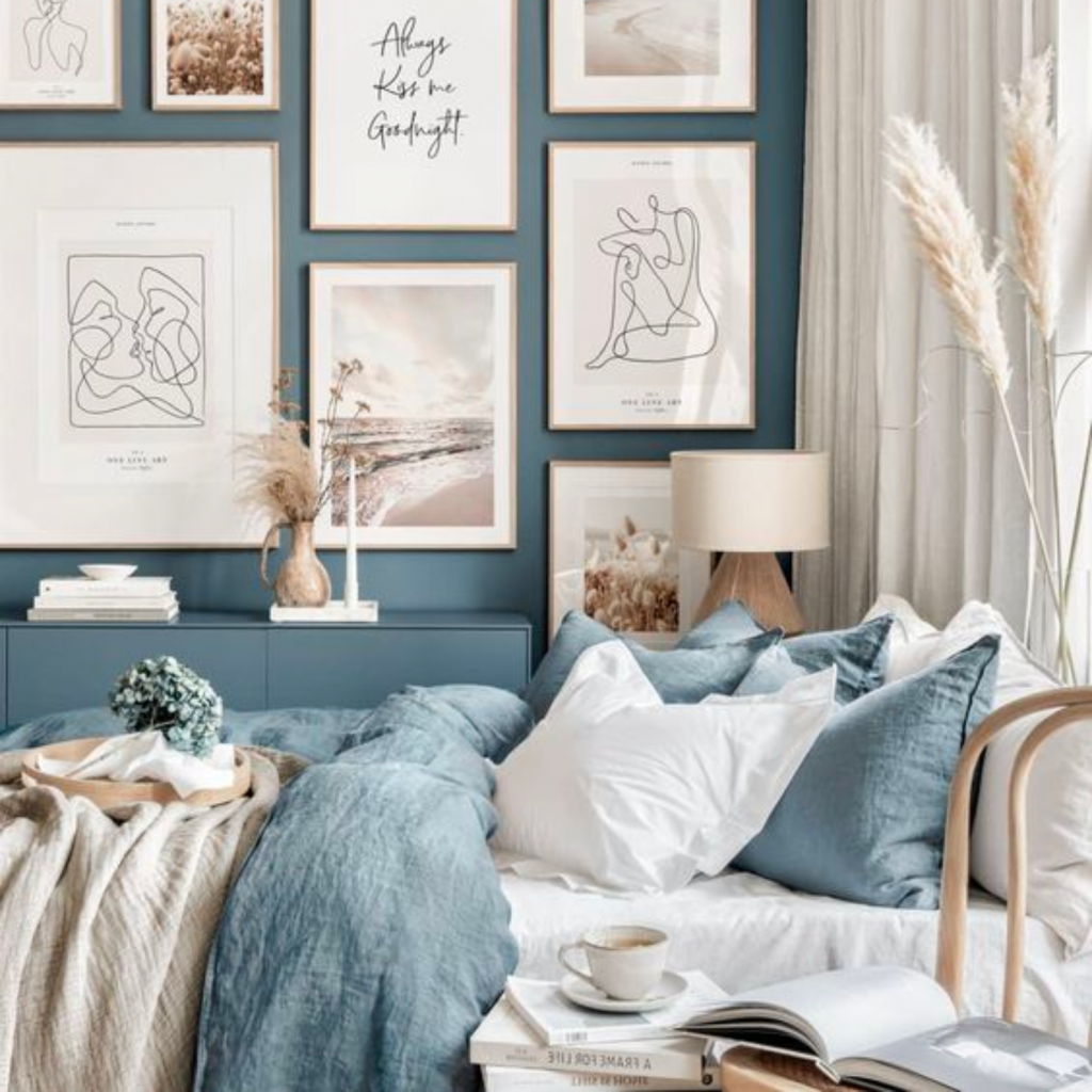 relaxing-blue-color-palette-bedroom-art-gallery-wall-beautiful-bedding-bright-area-by-window