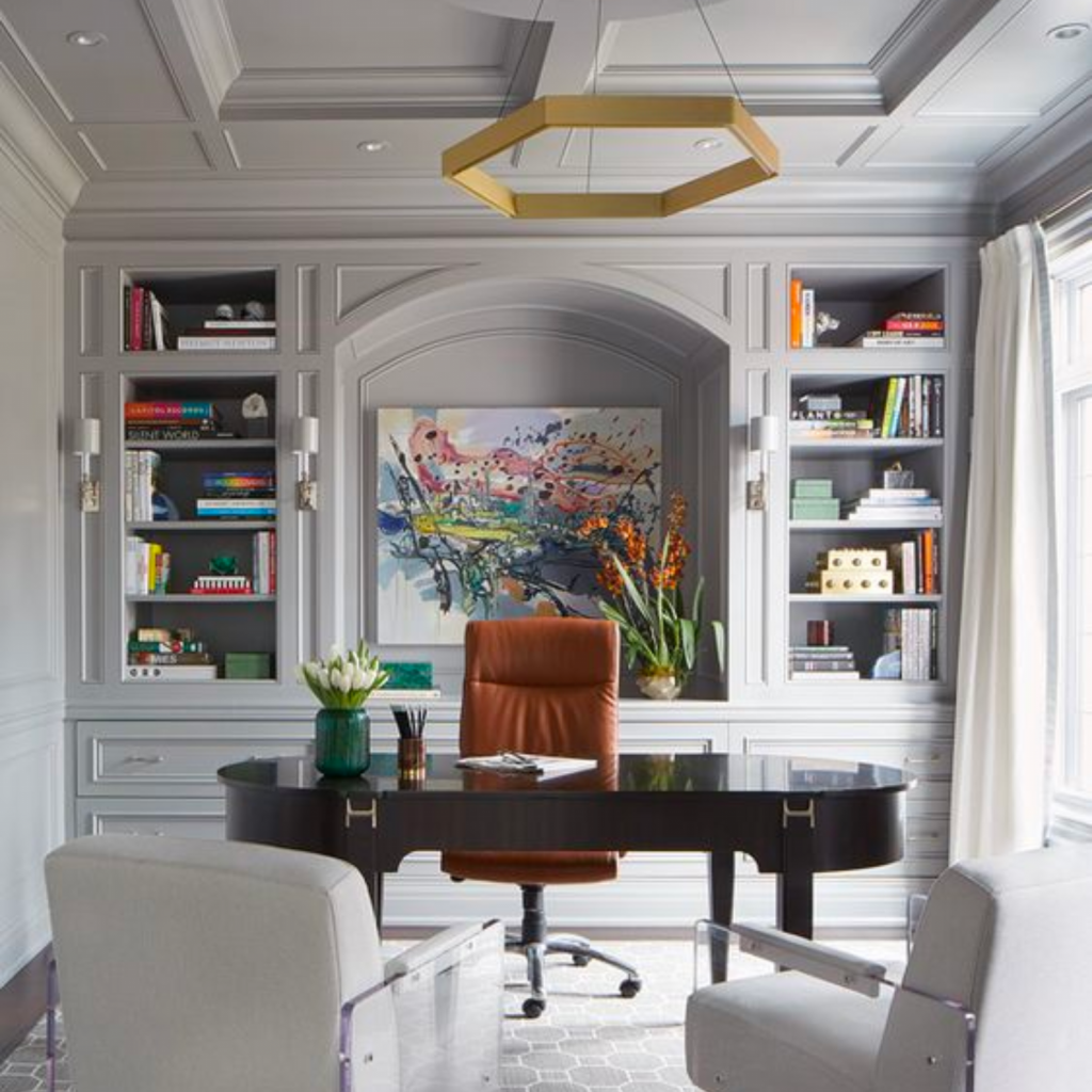 Custom built home office with expertly designed ceiling architecture.  Color palette is light grey with white accent chairs and brass metals.