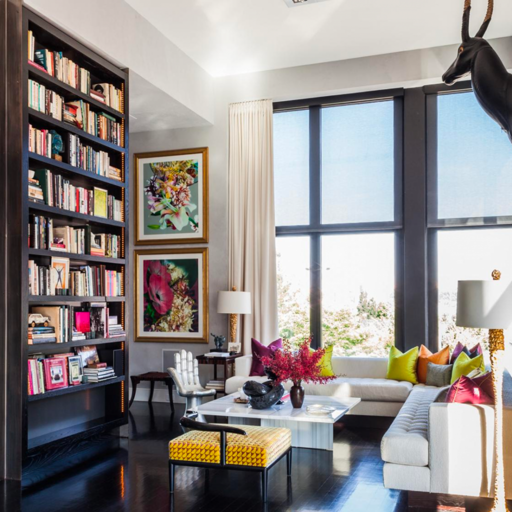 Luxury living room designed by an interior designer in NYC to be sophisticated yet colorful.  Dark wood tones are artfully contrasted by bright, bold colors.