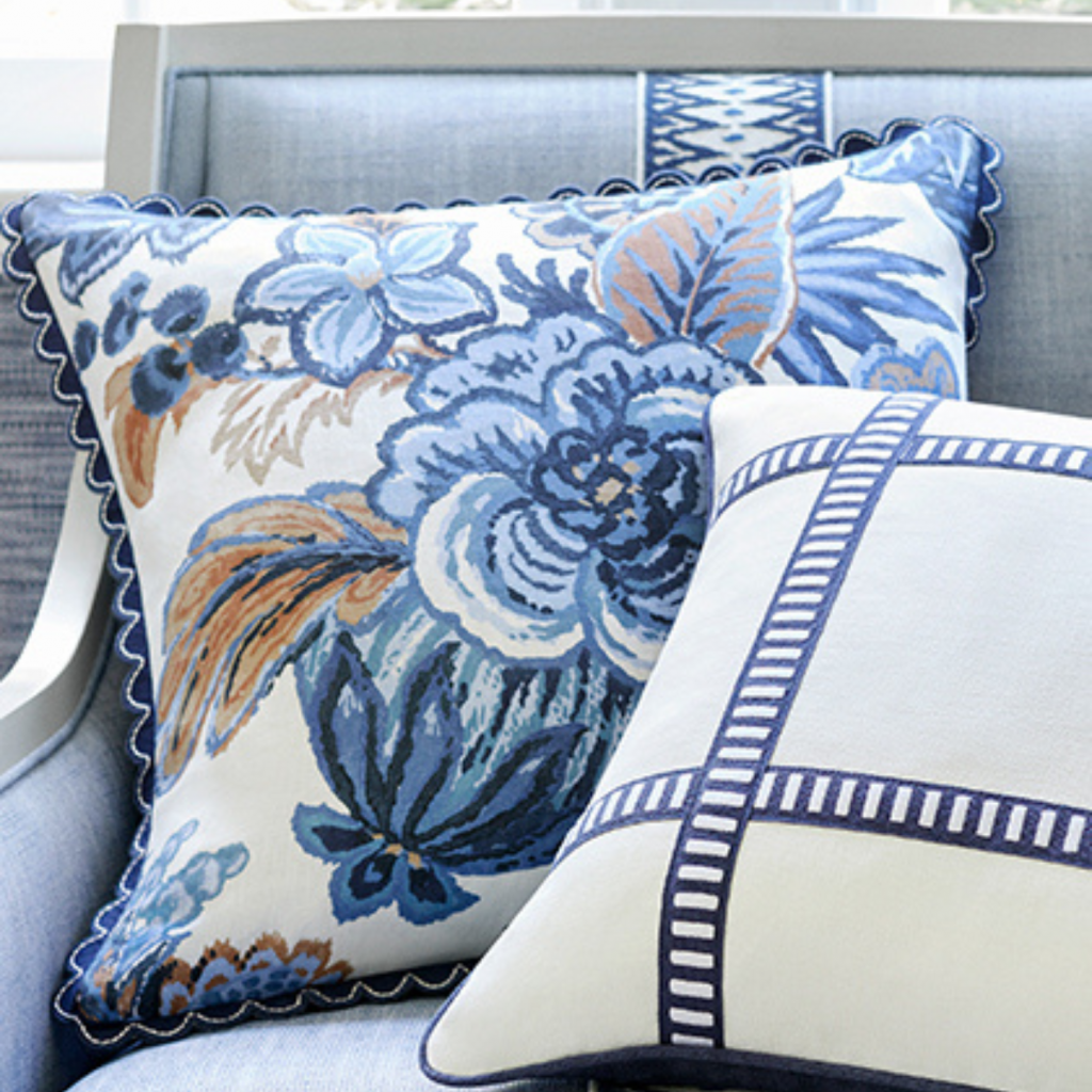pattern-mixing-blue-fabric-pillows-on-a-light-blue-armchair
